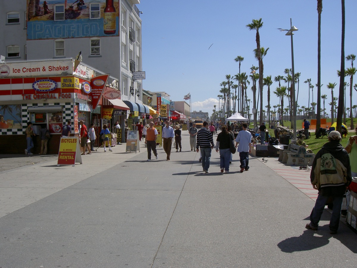 Shops and visitors along the Venice Beach promenade in Los Angeles